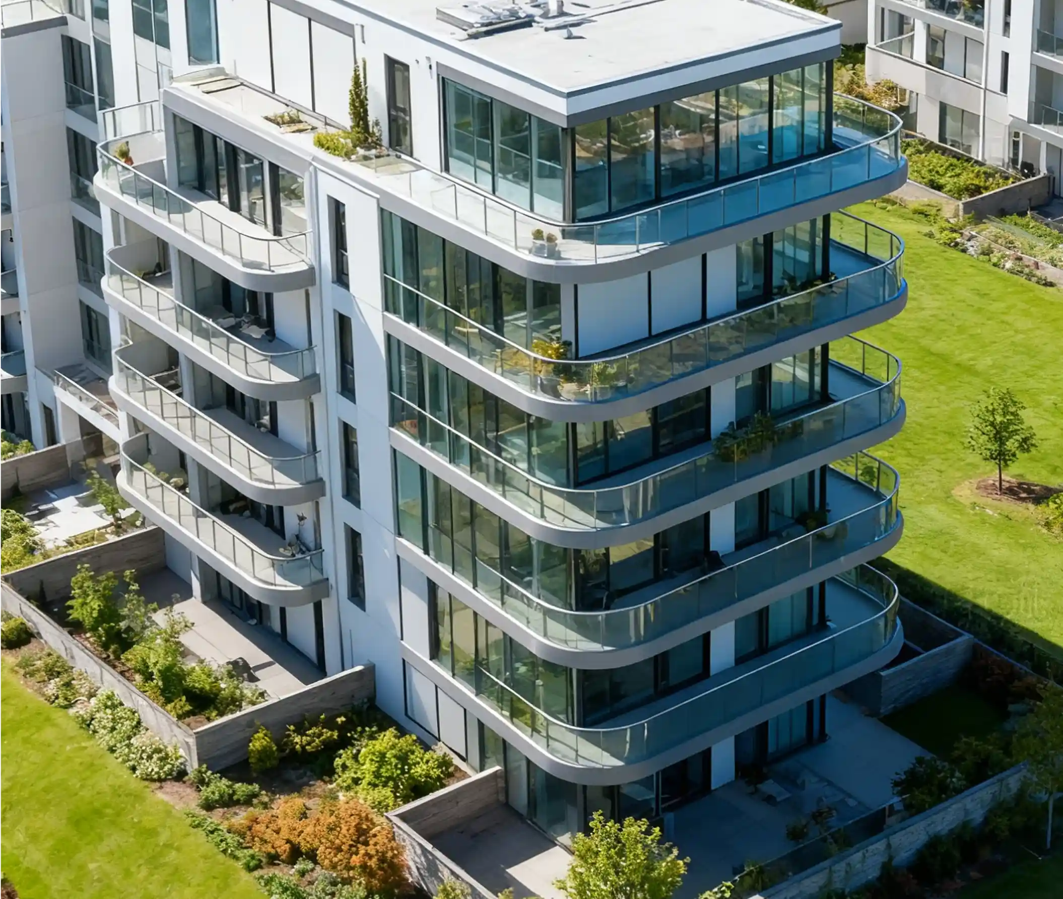 A modern multi-story apartment building with glass balconies, representing ETBOX’s customized design and global project planning service.