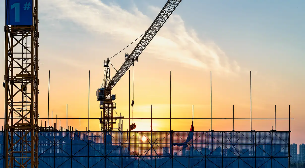 ETBOX engineer supervising window and door installation at a construction site